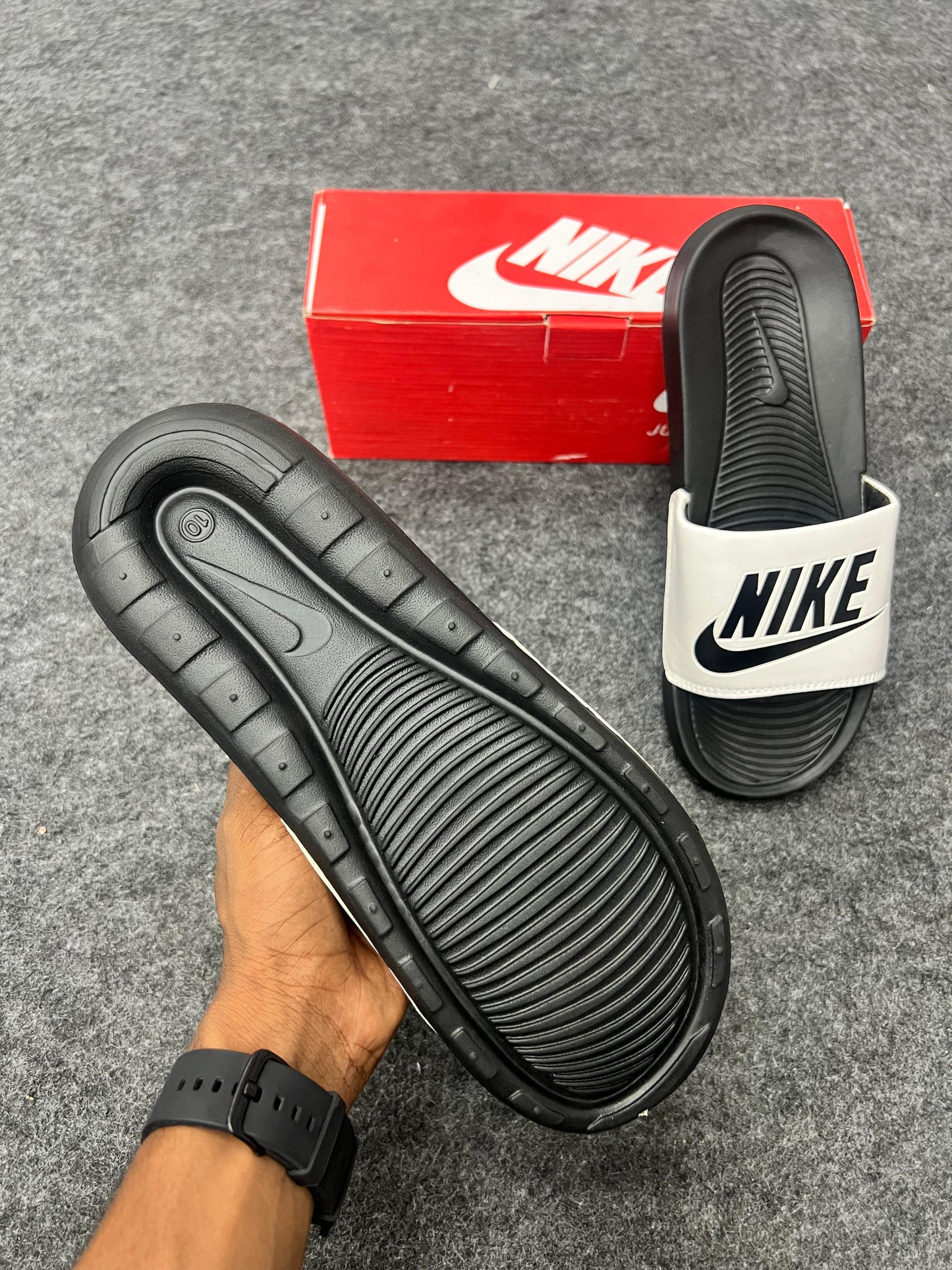 bold black logo on a white strap NIKE SLIDES