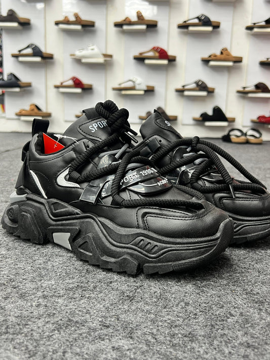 Bold and chunky black sneakers