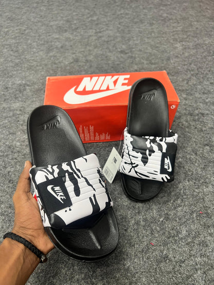 Nike slides with a black & white strap