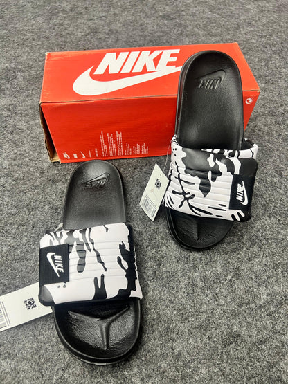 Nike slides with a black & white strap
