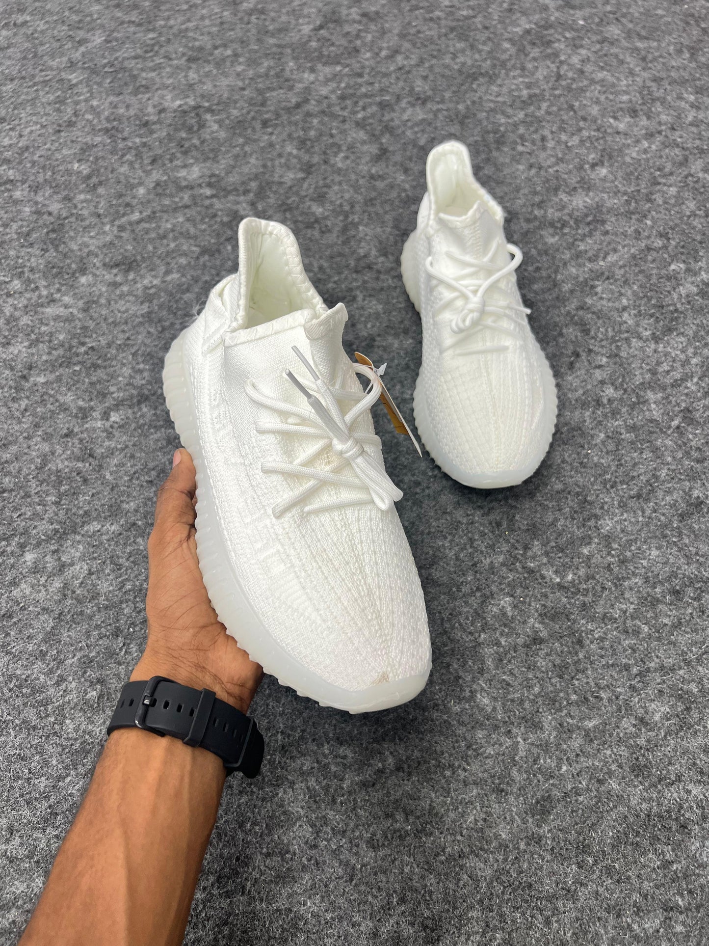 Clean, minimal, and stylish white Yeezy-style sneakers