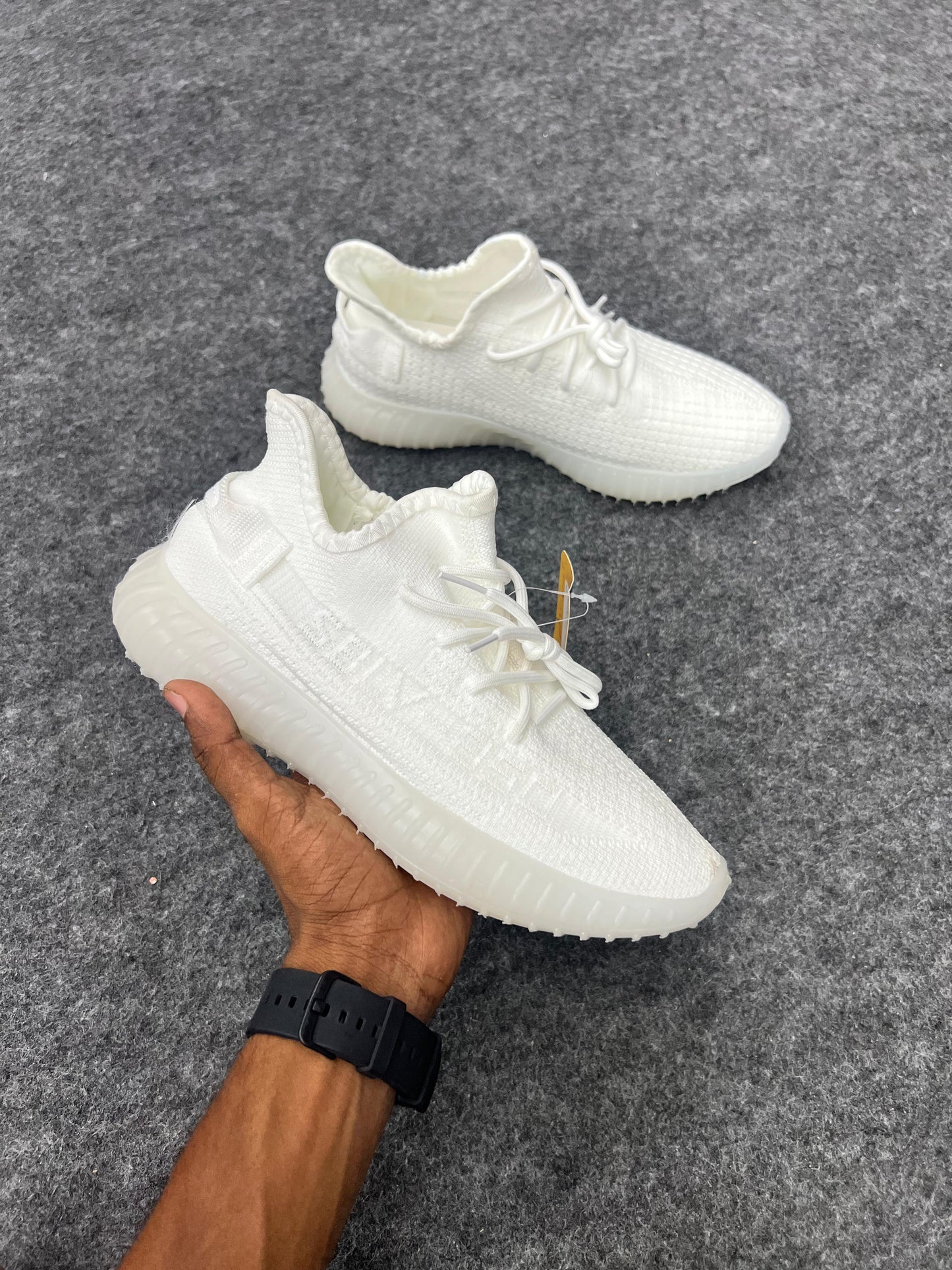 Clean, minimal, and stylish white Yeezy-style sneakers
