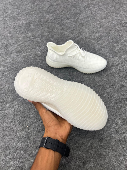 Clean, minimal, and stylish white Yeezy-style sneakers