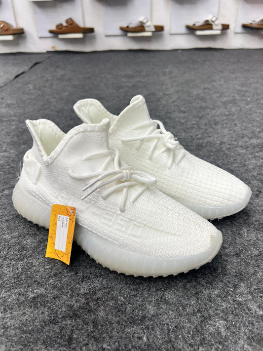 Clean, minimal, and stylish white Yeezy-style sneakers