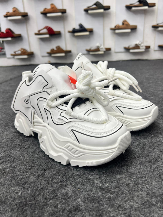 Chunky white sneakers with bold black