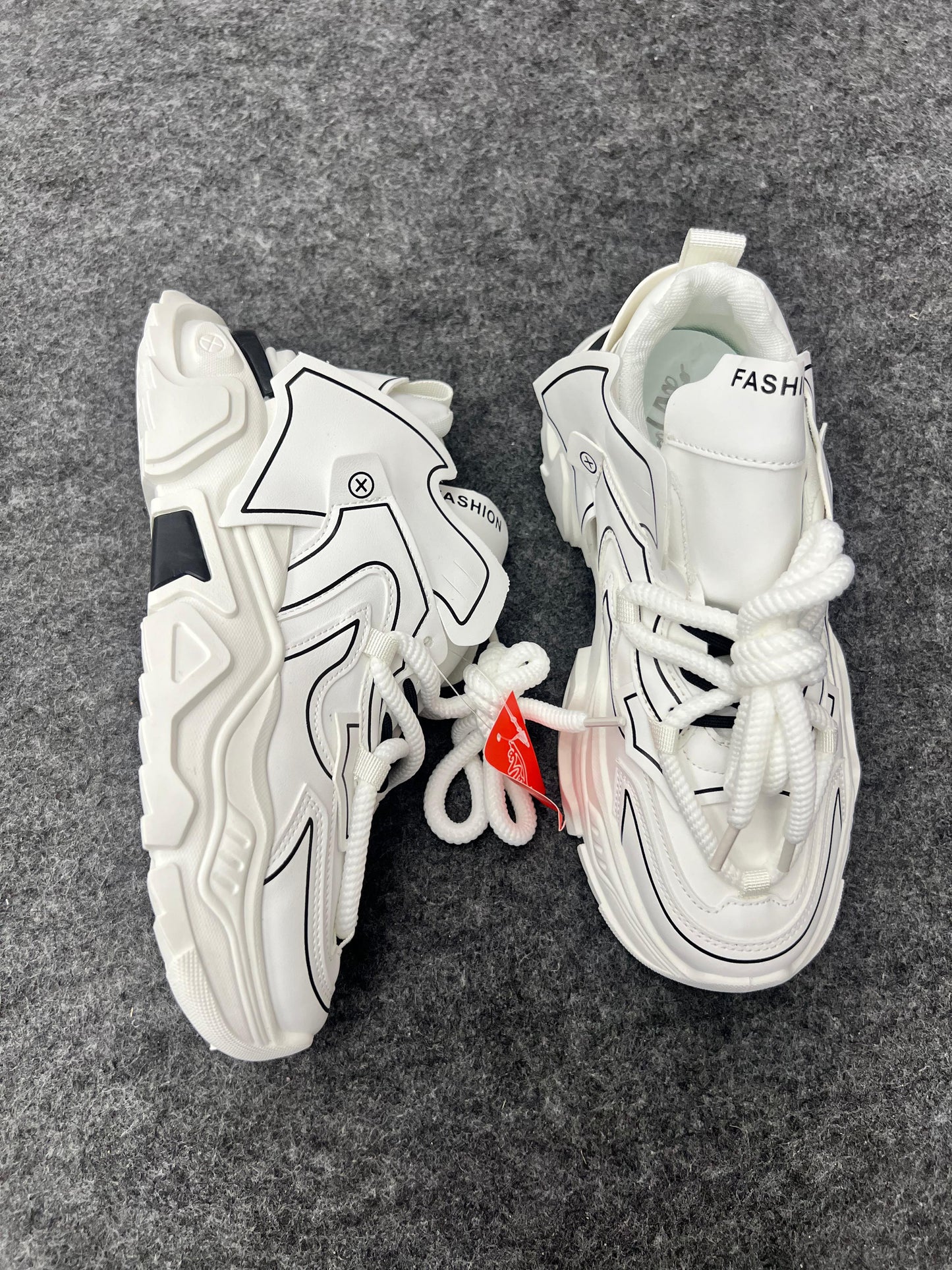 Chunky white sneakers with bold black