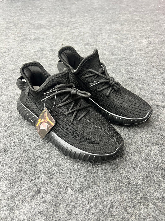 All-black Yeezy-style sneakers