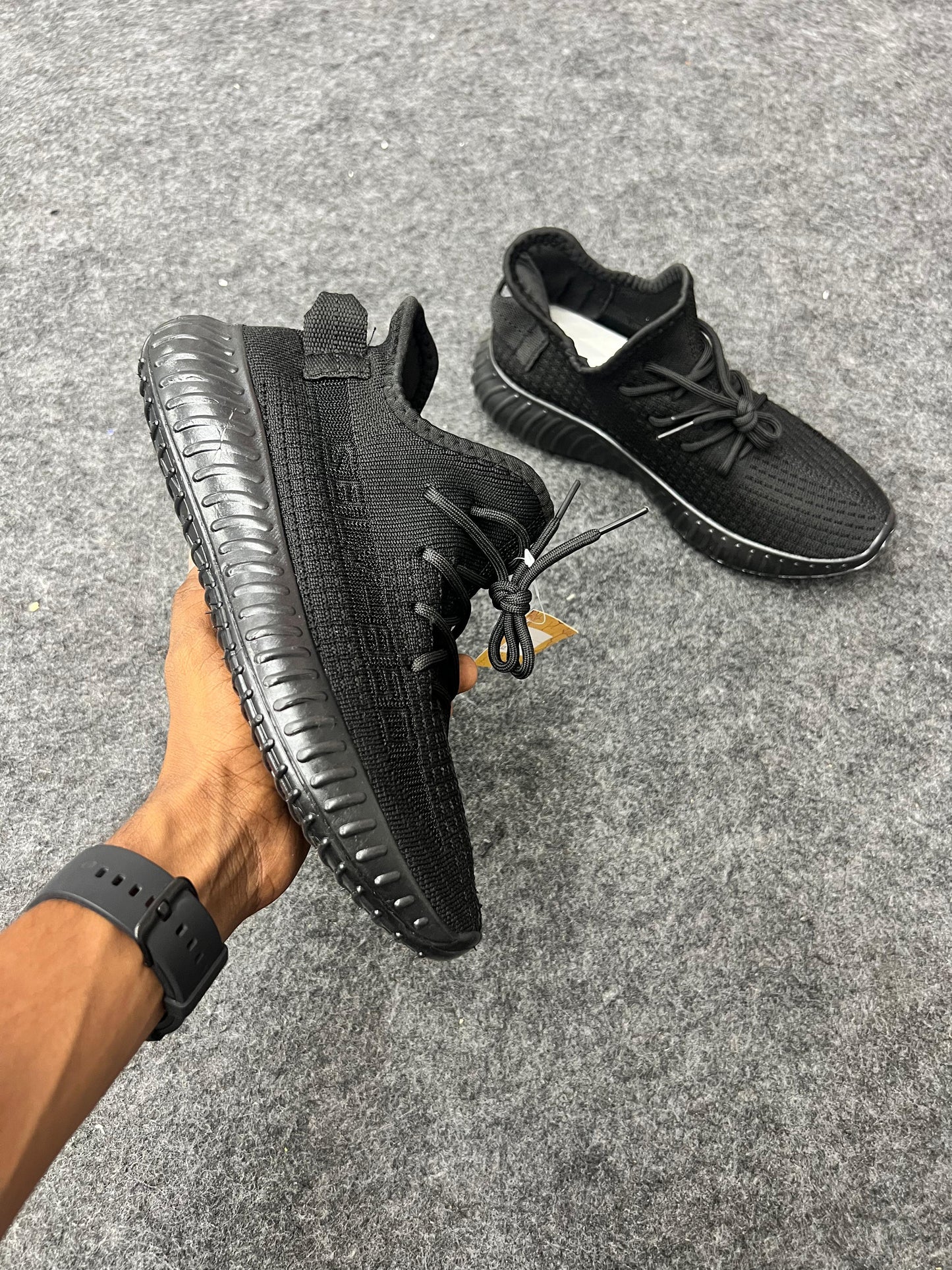 All-black Yeezy-style sneakers