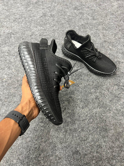 All-black Yeezy-style sneakers