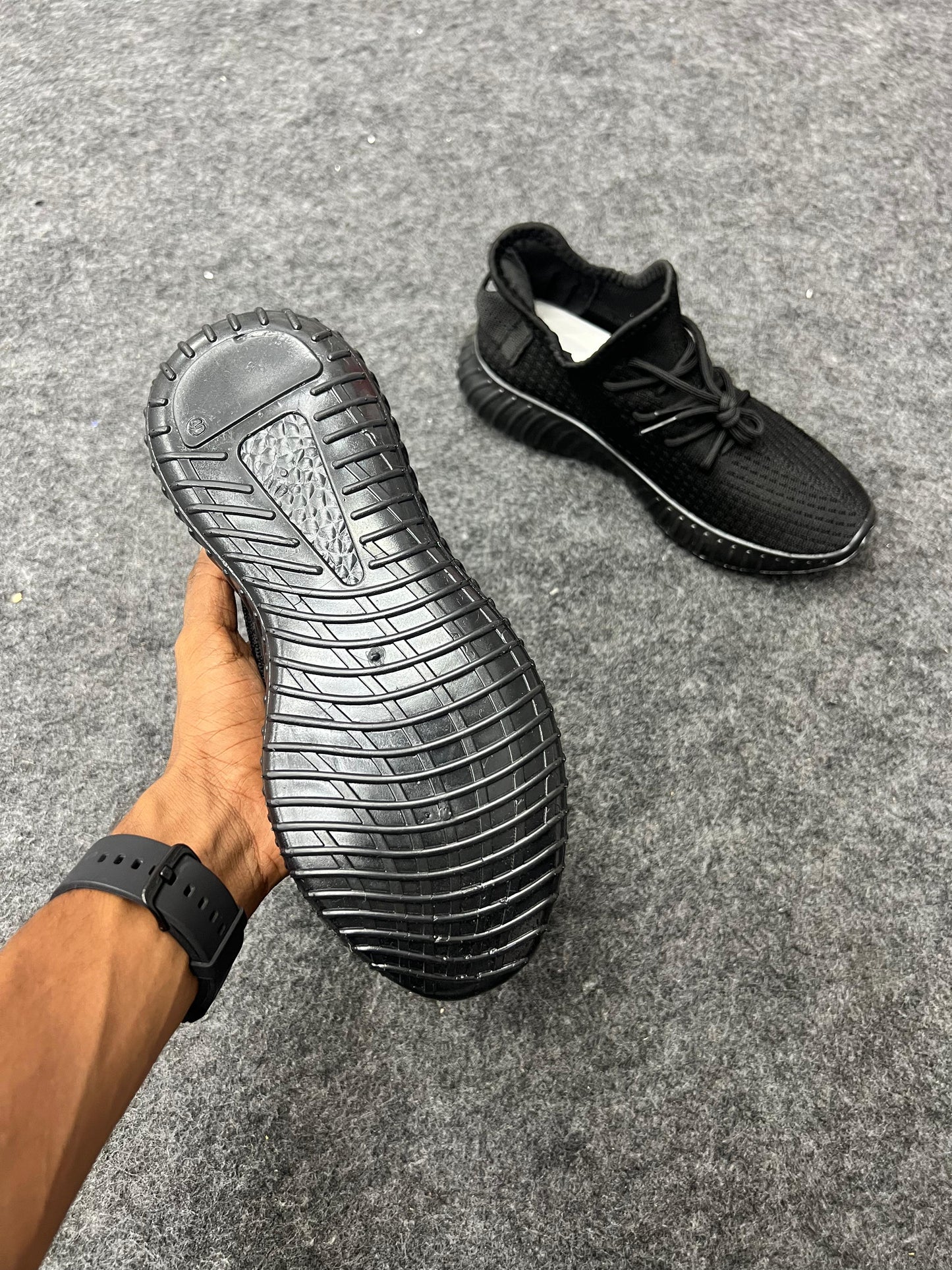 All-black Yeezy-style sneakers