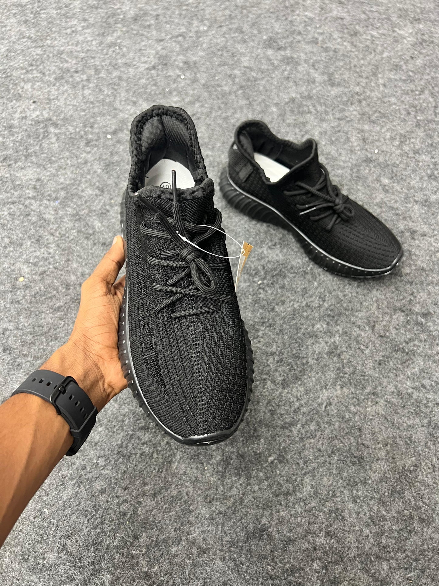 All-black Yeezy-style sneakers
